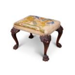 A 19TH CENTURY IRISH MAHOGANY FOOTSTOOL WITH THE ARMS OF THE EARLY OF DERBY