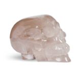 A SOLID CARVED ROCK CRYSTAL MODEL OF A HUMAN SKULL