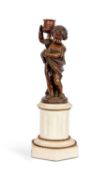 A MID 19TH CENTURY FRENCH BRONZE FIGURAL CANDLESTICK MODELLED AS WINTER