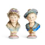 A PAIR OF LATE 19TH CENTURY BISQUE PORCELAIN BUSTS OF CHILDREN AFTER REINHOLD MOLLER