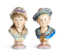 A PAIR OF LATE 19TH CENTURY BISQUE PORCELAIN BUSTS OF CHILDREN AFTER REINHOLD MOLLER