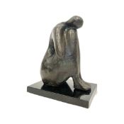 AN ABSTRACT BRONZE FIGURE OF A SEATED WOMAN