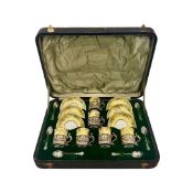 AN EDWARDIAN SILVER AND PORCELAIN COFFEE SET IN TRAVELLING CASE, 1904