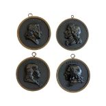 A GROUP OF FOUR 19TH CENTURY ‘BOIS DURCI’ PORTRAIT PLAQUES OF FRENCH NOTABLES