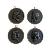 A GROUP OF FOUR 19TH CENTURY ‘BOIS DURCI’ PORTRAIT PLAQUES OF FRENCH NOTABLES