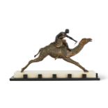 AN EARLY 20TH CENTURY FRENCH ART DECO PERIOD FIGURE OF A CAMEL RIDER