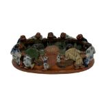 A CHINESE GLAZED EARTHENWARE BOWL MODELLED WITH CHILDREN