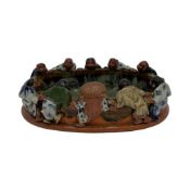 A CHINESE GLAZED EARTHENWARE BOWL MODELLED WITH CHILDREN