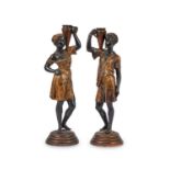 A PAIR OF LATE 19TH CENTURY FRENCH PATINATED AND COLD PAINTED SPELTER ARAB FIGURAL CANDLESTICKS
