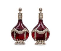 A PAIR OF LATE 19TH CENTURY GERMAN SILVER AND GLASS WINE DECANTERS BY KARL KURZ