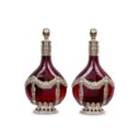 A PAIR OF LATE 19TH CENTURY GERMAN SILVER AND GLASS WINE DECANTERS BY KARL KURZ