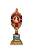 A FABERGE STYLE DIAMOND ENCRUSTED, GUILLOCHE ENAMEL AND SILVER GILT EGG