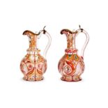 FOR THE PERSIAN MARKET: A HARLEQUIN PAIR OF 19TH CENTURY BOHEMIAN GLASS EWERS