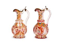 FOR THE PERSIAN MARKET: A HARLEQUIN PAIR OF 19TH CENTURY BOHEMIAN GLASS EWERS