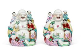 A PAIR OF CHINESE FAMILLLE ROSE GROUPS OF FERTILITY BUDDHAS