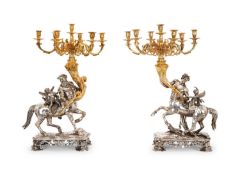 A MASSIVE PAIR OF SILVER AND SILVER GILT ITALIAN BAROQUE STYLE CANDELABRA
