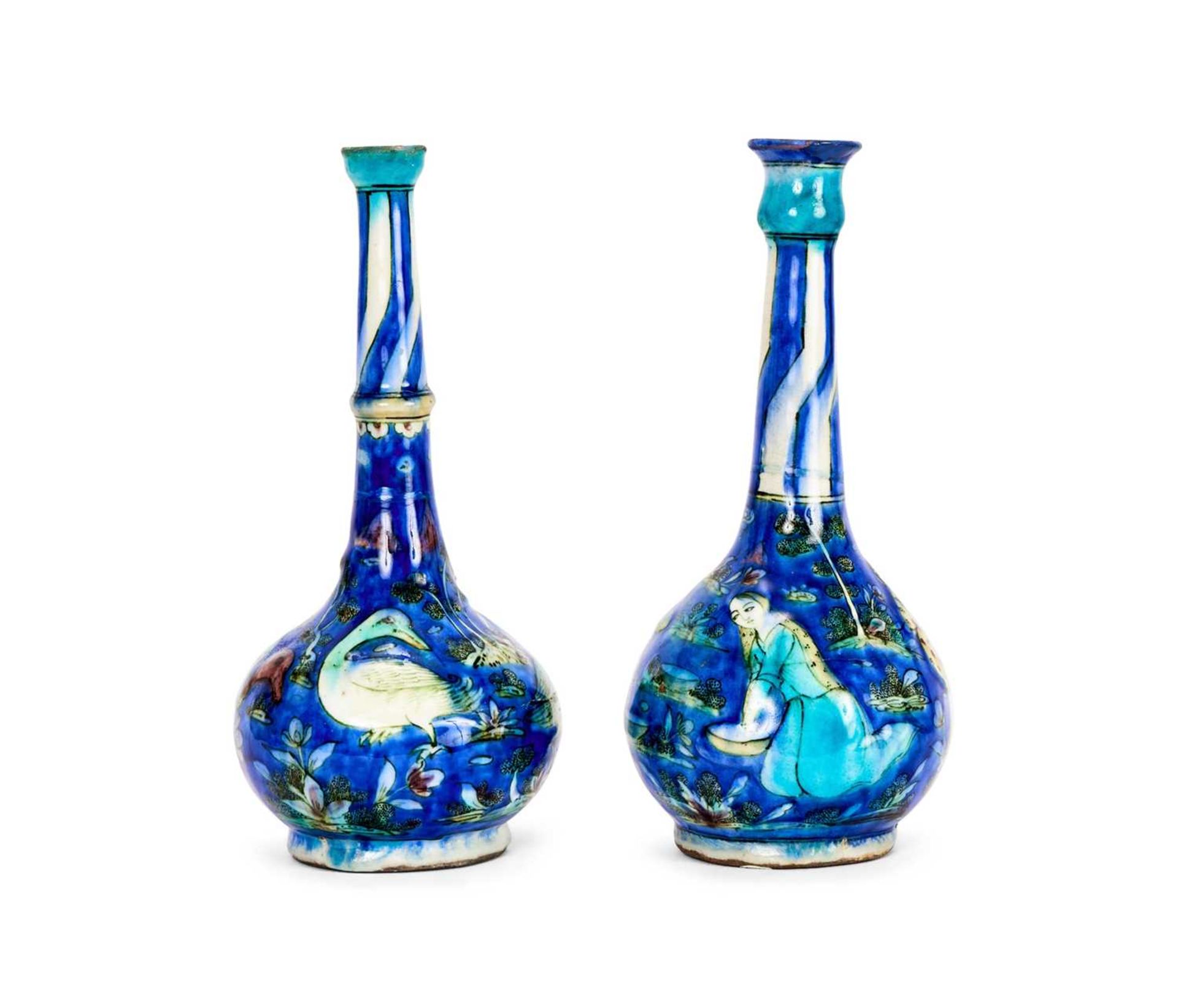 A HARLEQUIN PAIR OF 19TH CENTURY PERSIAN QAJAR BOTTLE VASES