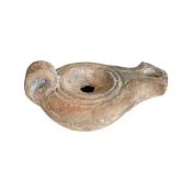 AN ANCIENT SYRIO PALESTINE TERRACOTTA OIL LAMP, 1ST - 4TH CENTURY AD.