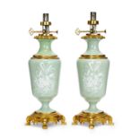 A PAIR OF LATE 19TH CENTURY CELADON PATE SUR PATE PORCELAIN AND ORMOLU MOUNTED LAMP BASES