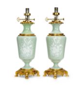 A PAIR OF LATE 19TH CENTURY CELADON PATE SUR PATE PORCELAIN AND ORMOLU MOUNTED LAMP BASES