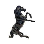 A 20TH CENTURY BRONZE MODEL OF A REARING HORSE