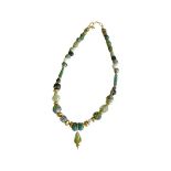 A ROMAN GLASS AND GOLD NECKLACE
