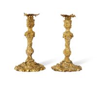 A PAIR OF MID 19TH CENTURY FRENCH ROCOCO STYLE GILT BRONZE CANDLESTICKS