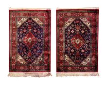 A PAIR OF PERSIAN GHOM SILK RUGS