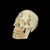 A 1950'S RESIN ANATOMICAL MODEL OF A HUMAN SKULL
