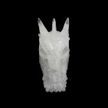 A SOLID CARVED ROCK CRYSTAL SCULPTURE OF A DRAGON'S HEAD