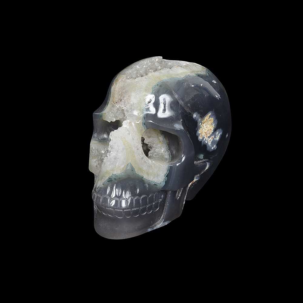 A SOLID SPECIMEN OF CHALCEDONY CARVED IN THE FORM OF A HUMAN SKULL - Image 2 of 2