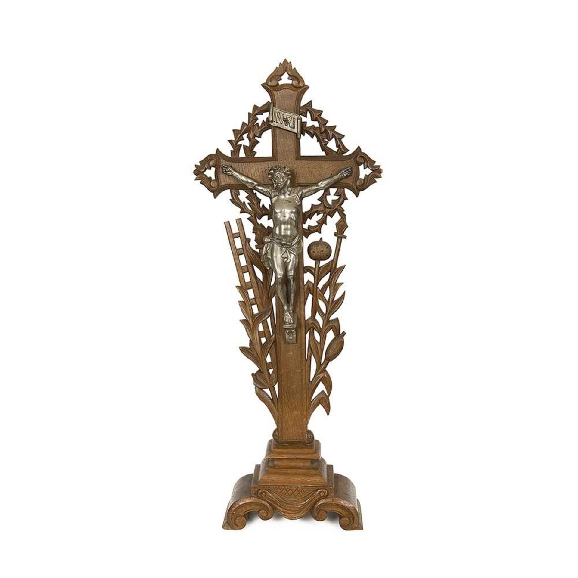 AN EARLY 20TH CENTURY OAK AND SILVERED METAL CRUCIFIX