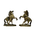A PAIR OF 19TH CENTURY BRONZE MODELS OF THE MARLEY HORSES AFTER COUSTOU (FRENCH, 1677-1746)