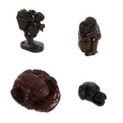 FOUR CARVED FRUITWOOD ANIMAL NETSUKES