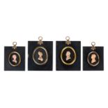 FOUR EARLY 19TH CENTURY PASTE GLASS MINIATURE PORTRAITS IN THE MANNER OF TASSIE