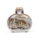 A CHINESE REVERSE GLASS PAINTED SNUFF BOTTLE DECORATED WITH A TIGER