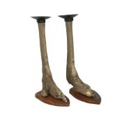 A PAIR OF TAXIDERMY OSTRICH FEET TORCHERES