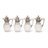 A FINE SET OF FOUR LATE 19TH CENTURY FRENCH SILVER AND CUT GLASS CLARET JUGS