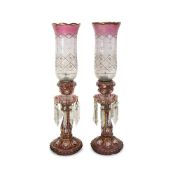 A PAIR OF BACCARAT STYLE EARLY 20TH CENTURY RUBY GLASS LUSTRES