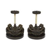 A PAIR OF MID 20TH CENTURY BRONZE AND CAMEL BONE MONKEY CANDLESTICKS