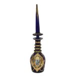 A PERSIAN BLUE GLASS AND GILT DECORATED DECANTER