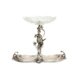 AN ART NOUVEAU PERIOD SILVER PLATED AND CUT GLASS CENTREPIECE BY WMF