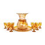AN IMPRESSIVE MID 19TH CENTURY BOHEMIAN ENGRAVED AND FLASHED AMBER GLASS PUNCH SET