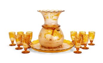 AN IMPRESSIVE MID 19TH CENTURY BOHEMIAN ENGRAVED AND FLASHED AMBER GLASS PUNCH SET