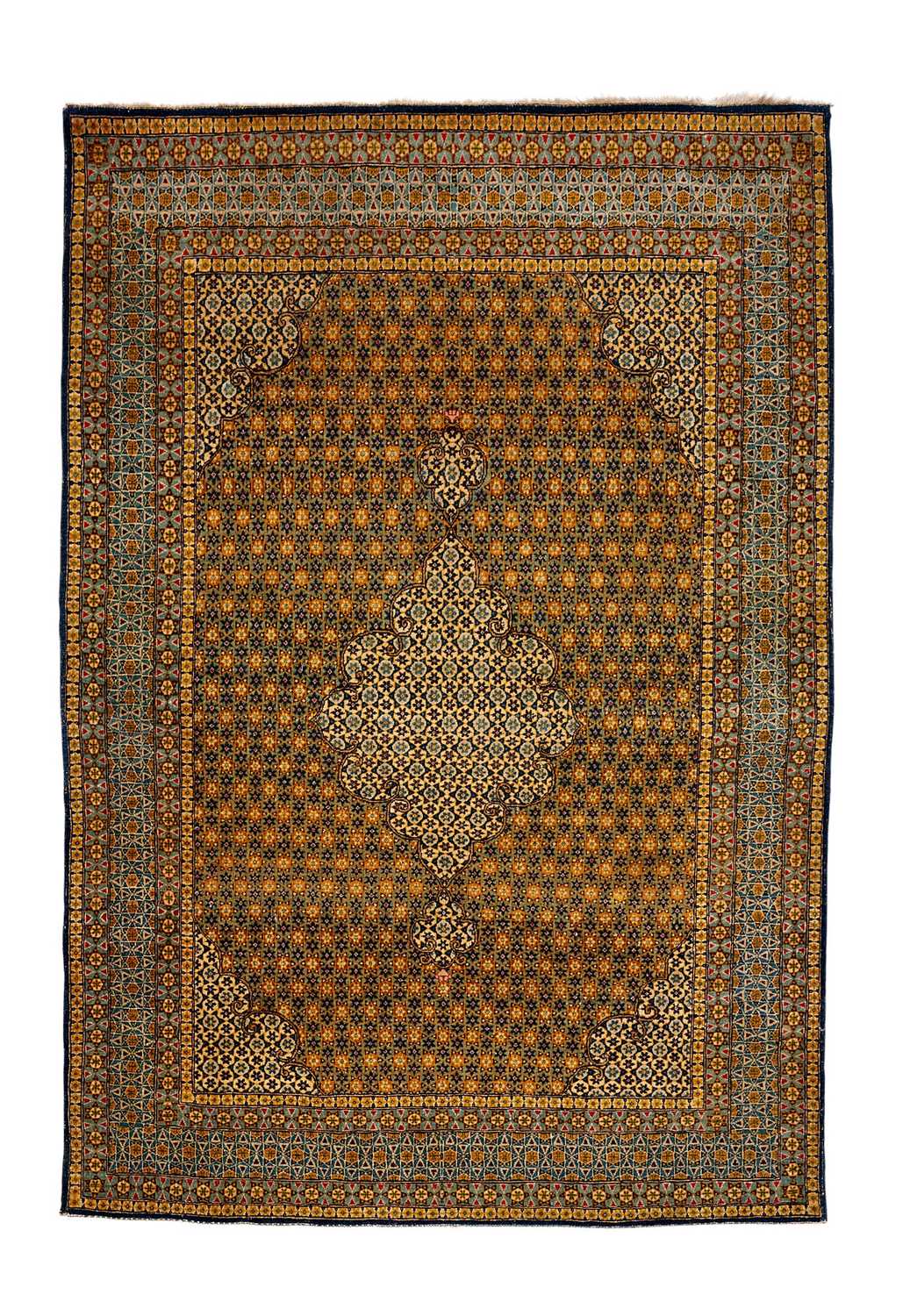 A MID 2OTH CENTURY QUM CARPET