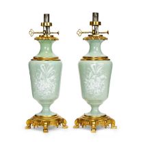 A PAIR OF LATE 19TH CENTURY CELADON PATE SUR PATE PORCELAIN AND ORMOLU MOUNTED LAMP BASES