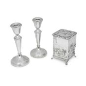 SILVER: A 19TH CENTURY TEA CADDY TOGETHER WITH A PAIR OF CANDLESTICKS