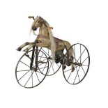 A LATE 19TH CENTURY FRENCH PAINTED WOOD HORSE CHAIN DRIVEN TRICYCLE OR VELOCIPEDE