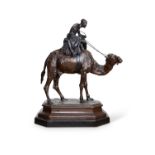 MANNER OF ANTOINE-LOUIS BARYE (FRENCH, 1795-1875) : A LARGE BRONZE GROUP OF AN ARAB BOY AND CAMEL