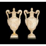 A LARGE PAIR OF 19TH CENTURY ITALIAN ALABASTER URNS AND COVERS IN THE STYLE OF PIRANESI